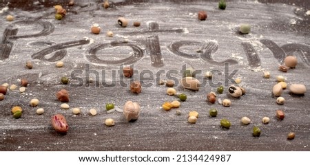 Mixed dry organic cereal and grain seed pile on wooden background. For healthy food ingredient or carbohydrate food type and agricultural product concept. Royalty-Free Stock Photo #2134424987