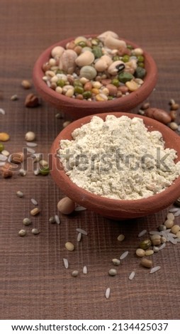 Mixed dry organic cereal and grain seed pile on wooden background. For healthy food ingredient or carbohydrate food type and agricultural product concept. Royalty-Free Stock Photo #2134425037