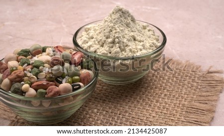 Mixed dry organic cereal and grain seed pile on wooden background. For healthy food ingredient or carbohydrate food type and agricultural product concept. Royalty-Free Stock Photo #2134425087