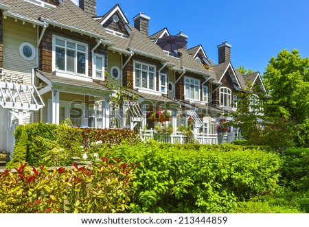 Residential townhouses on sunny day in Vancouver, British Columbia, Canada.