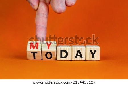 Today is my day symbol. Businessman turns wooden cubes and changes concept words Today to My day. Beautiful orange table orange background, copy space. Business, motivation today is my day concept.