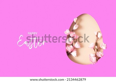 Paper cut Easter egg with cherry blossom branch. Easter holiday concept