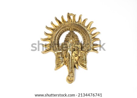 Golden brass artistic wall hanging Ganesh metal showpiece emblom or artifacts design Royalty-Free Stock Photo #2134476741