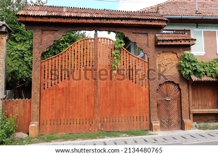 Traditional wood sculpture, decorated gate in Maramures in Romania