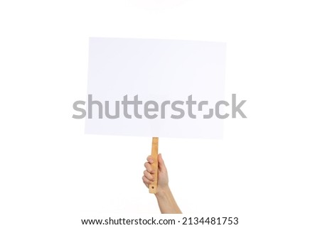Hand holds protest sign, isolated on white background