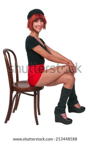 Beautiful young woman sitting in a chair