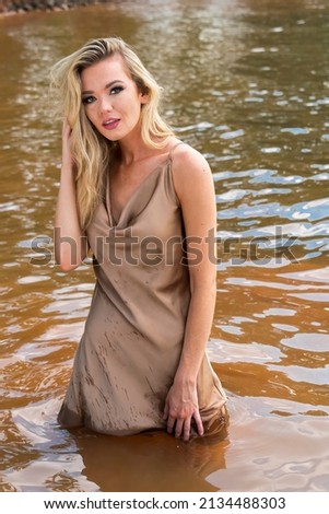 A gorgeous blonde model enjoys a day at the lake