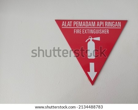 safety signage for industrial. written in Indonesian ' alat pemadam api ringan ' which means fire extinguisher. isolated background in white. copyspace