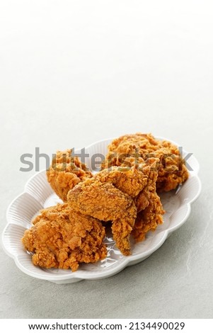Fried chicken wings on Ceramic Plate. Breaded Crispy fried kentucky chicken tasty dinner