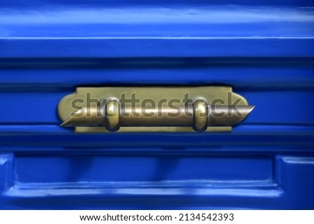 Old Neoclassical house cobalt blue wooden door with an antique brass handle in Nafplio, Greece. Royalty-Free Stock Photo #2134542393