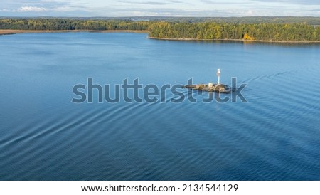 Beautiful early morning scenery with an open view of the natural environment and natural archipelago with plenty of islands standing on the water surface.   Royalty-Free Stock Photo #2134544129