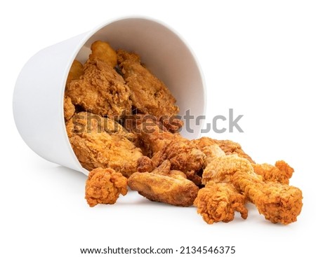 Fried chicken in paper bucket isolated on white background, Fried chicken on white With clipping path. Royalty-Free Stock Photo #2134546375