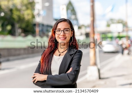 Portrait of a businesswoman on the street of a city. Royalty-Free Stock Photo #2134570409