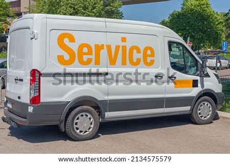 Big Yellow Sign Service at Company Support Van Vehicle Side
