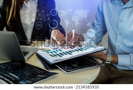 Business teamwork or business partners discussing documents and meeting at the modern office desk. Analysis icon, Innovation Graphs Interfaces. Business workplace strategy concept.