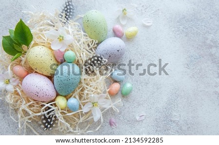 Top view of colorful easter eggs on concrete background