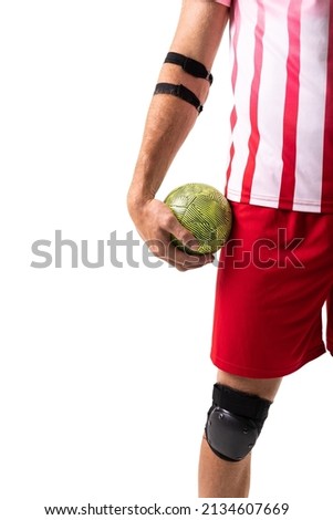Midsection of young male caucasian handball player holding green ball against white background. unaltered, sport, competition and match concept.