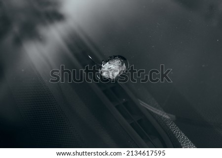 windshield chip, stone crack in glass Royalty-Free Stock Photo #2134617595