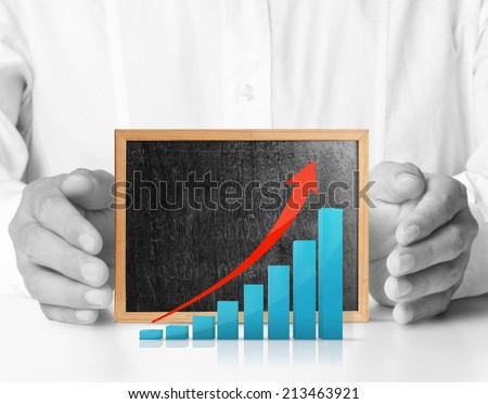 Hands holding blackboard with chart