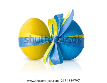 Easter eggs are blue, yellow tied with a bow. Flag of Ukraine. War in Ukraine Royalty-Free Stock Photo #2134639797