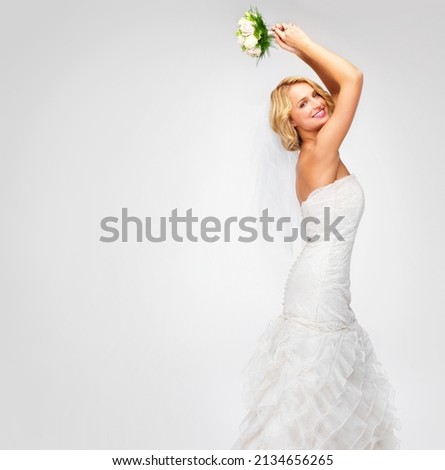 Get ready to catch the bouquet. Gorgeous young bride getting ready to throw her bouquet. Royalty-Free Stock Photo #2134656265