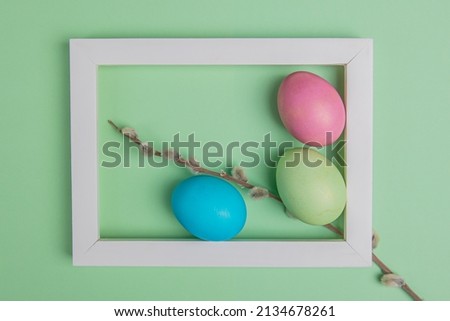 on a green background easter eggs in a white frame