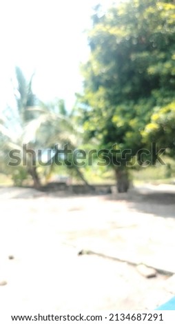 Beautiful bokeh background of defocused tree. Natural blurred backdrop of green foliage
