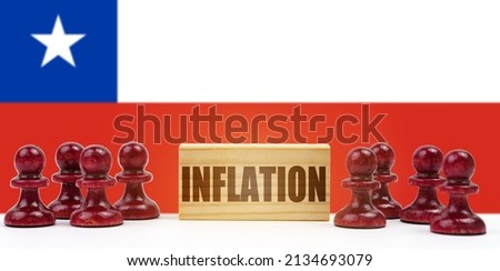national concept. Against the background of the flag of Chile, pawns and a sign with the inscription - inflation