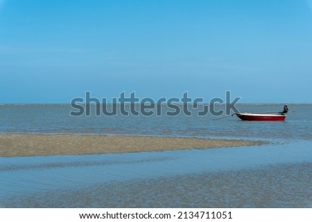Seascape background, a red boat, horizontal beach and sky.