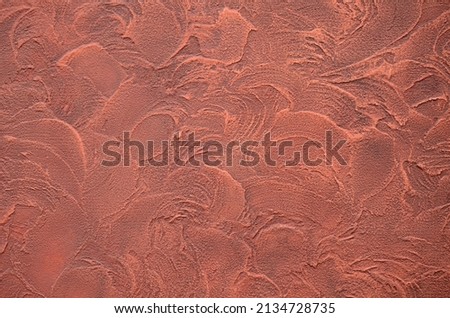 Texture of fresh concrete wall on construction site .Structure of decorative plaster .Uneven wall surface with decorative beige plaster.Saffron plastered brick wall texture. Royalty-Free Stock Photo #2134728735