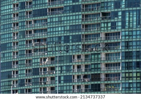 Abstract reflecting on a building with mirrored glass

