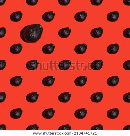 Fresh avocado pattern on bright red background. Pop art design, creative summer food concept. Top view, banner or endless pattern. Avocado haas ingredients for guacamole, minimal flat style.
