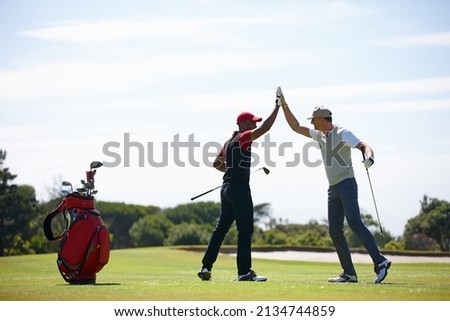 Good shot buddy. Shot of two happy men playing a game of golf. Royalty-Free Stock Photo #2134744859