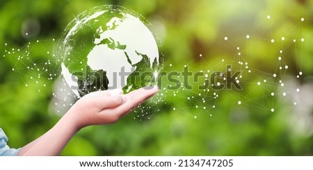 Woman holding icon of Earth. Concept day earth Save the world save environment. Ecology concept. Royalty-Free Stock Photo #2134747205