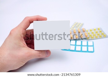close-up of a drug in a white box held by a man in his hand and other drugs in the background on a white background
 Royalty-Free Stock Photo #2134761309
