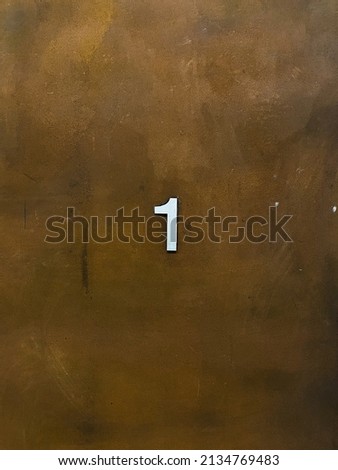 Number 1 sign on a Cotten steel wall