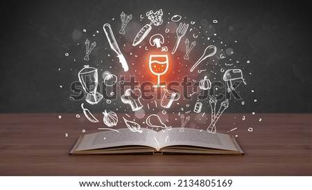 Open recipe book with food related icons above
