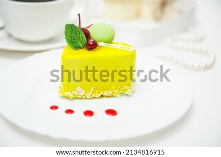 lemon yellow heart cake with cherries and cream