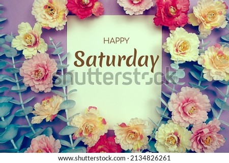 Happy Saturday typography text and flower decorate on purple background