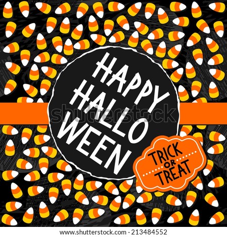 Halloween candy white yellow orange sweets with halloween wishes autumn holiday colorful card on dark round torn centerpiece on orange ribbon