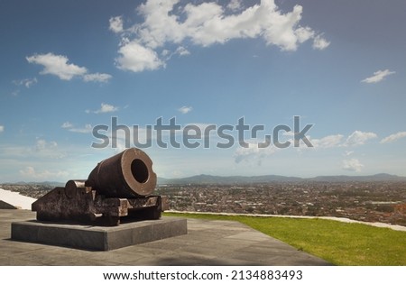 old war cannon in viewpoint of the city of Puebla, sunny summer day, for vacationers, no people Royalty-Free Stock Photo #2134883493