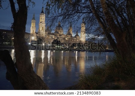 Photography of the blue hour in Zaragoza, next to the Pilar cathedral and the Piedra bridge, high resolution photography.
