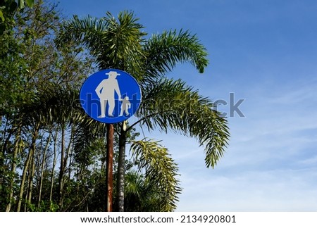 father and son road sign against the background of trees. illustration of an invitation to children about : go green, pollution free, save the earth, etc