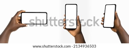 set of Black hand holding phone facing camera isolated on white background. blank screen, phone screen mockup, front view, clipping path, clipping mask Royalty-Free Stock Photo #2134936503