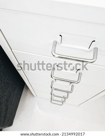 White locker and drawer in the room