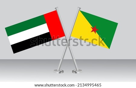 Crossed flags of United Arab Emirates (UAE) and French Guiana. Official colors. Correct proportion. Banner design
