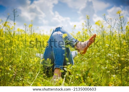 Relax in the field, yellow flowers and sunny summer time