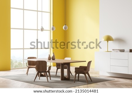 Bright dining room interior with chairs and wooden table, side view, panoramic window on countryside view, hardwood floor. Drawer with art decoration. 3D rendering