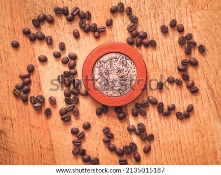 Round wooden leopard souvenir and coffee beans