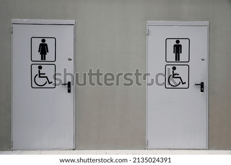 Man and woman toilets. Handicaped. France. 